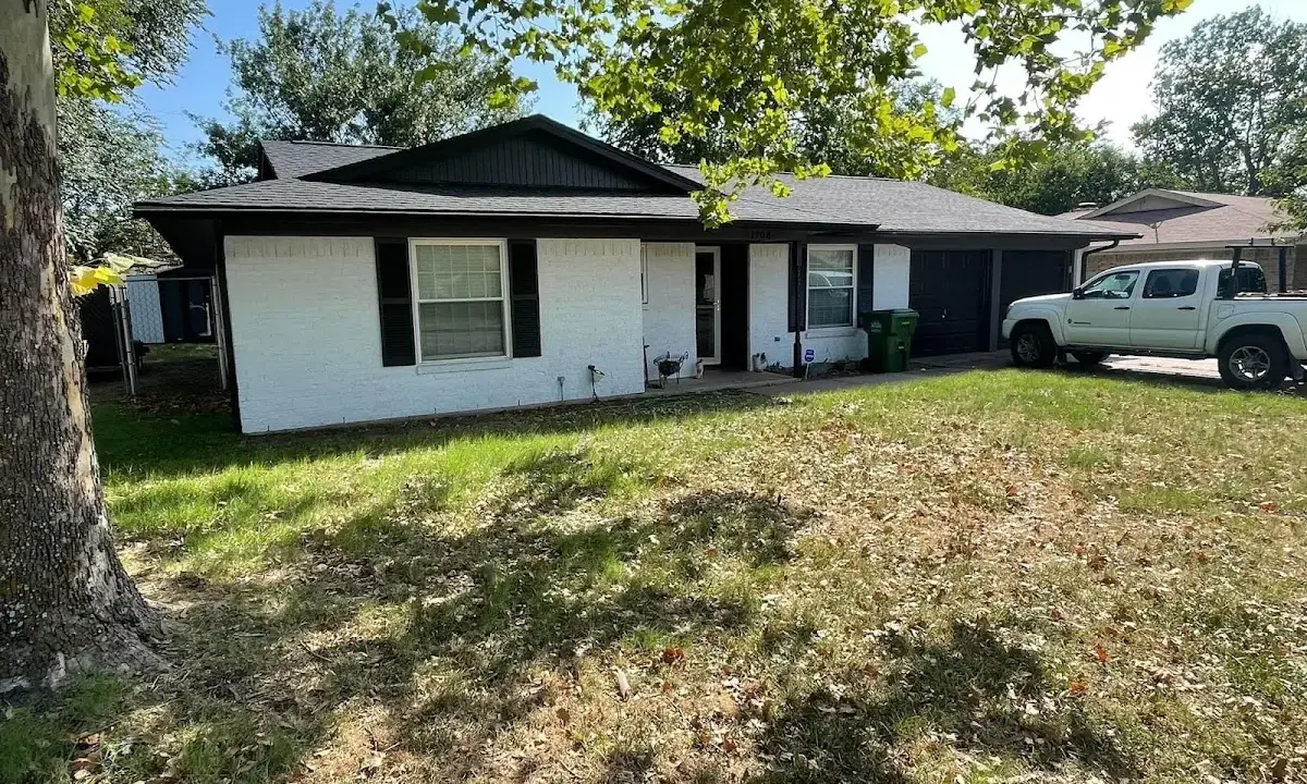 Professional roofing crew working on a residential roof in Bullskin
